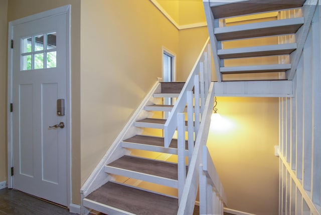 13220 Carpenter St, Omaha, NE 68138 - staircase featuring baseboards and wood finished floors