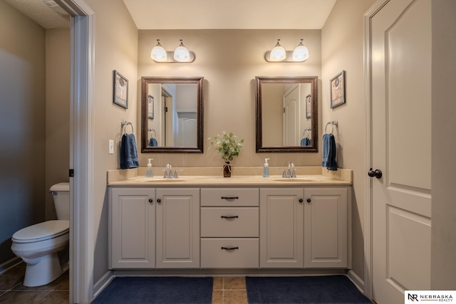 21313 Castlerock Ln, Gretna, NE 68028 - bathroom featuring double vanity, toilet, and tile patterned floors