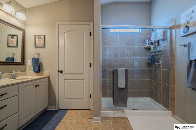 21313 Castlerock Ln, Gretna, NE 68028 - bathroom with vanity, tile patterned flooring, and a stall shower