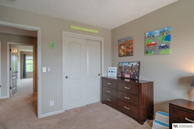 21313 Castlerock Ln, Gretna, NE 68028 - bedroom with light colored carpet, a closet, and baseboards