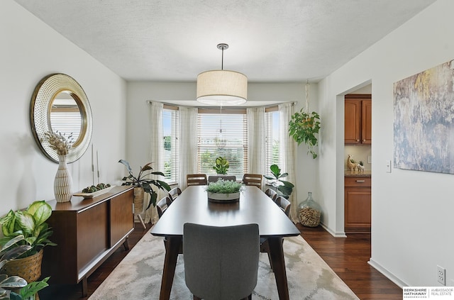 4103 N 147th St, Omaha, NE 68116 - dining space featuring dark wood-type flooring and baseboards