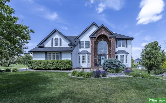 3902 Fox Ridge Dr, Bellevue, NE 68123 - view of front facade with a front lawn and roof with shingles