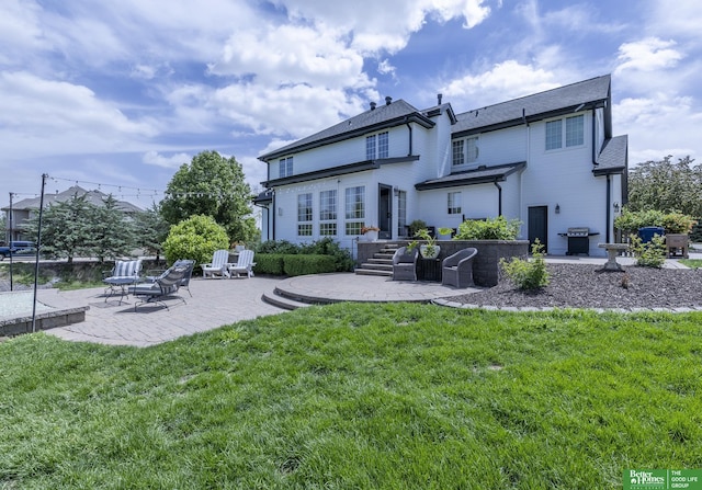 3902 Fox Ridge Dr, Bellevue, NE 68123 - rear view of house with a patio area and a lawn
