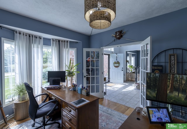 3902 Fox Ridge Dr, Bellevue, NE 68123 - office space featuring a chandelier, a textured ceiling, and french doors