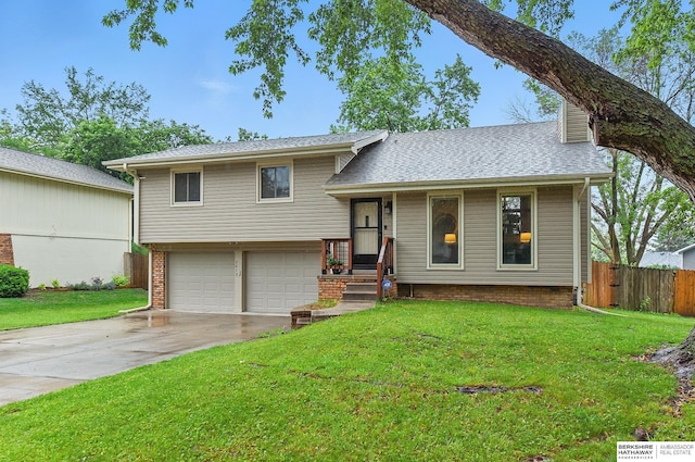 2615 Jack Pine St, Bellevue, NE 68123 - split level home with driveway, an attached garage, and roof with shingles