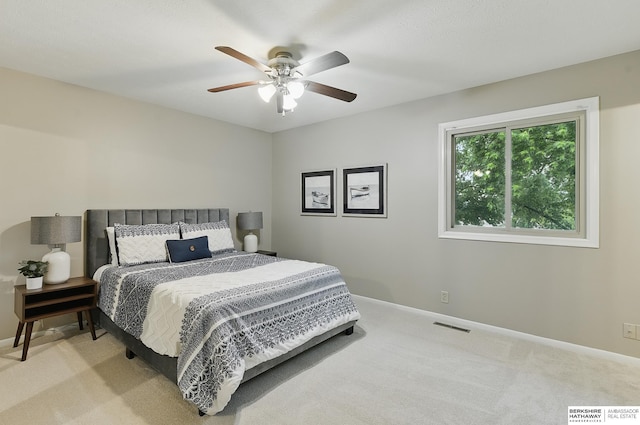 2615 Jack Pine St, Bellevue, NE 68123 - bedroom featuring light carpet, baseboards, and ceiling fan