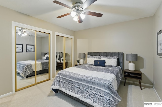 2615 Jack Pine St, Bellevue, NE 68123 - bedroom featuring light carpet, two closets, baseboards, and a ceiling fan