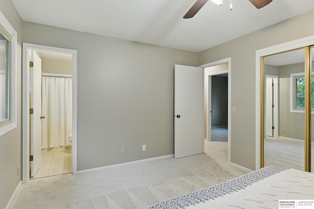 2615 Jack Pine St, Bellevue, NE 68123 - unfurnished bedroom featuring light carpet, ensuite bath, a ceiling fan, and baseboards
