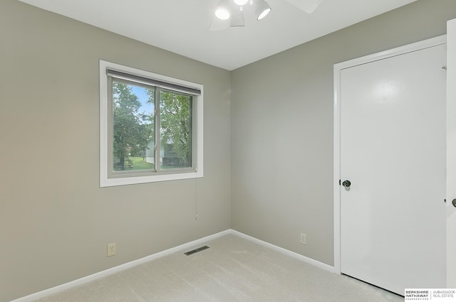 2615 Jack Pine St, Bellevue, NE 68123 - unfurnished bedroom featuring light colored carpet, baseboards, and a ceiling fan