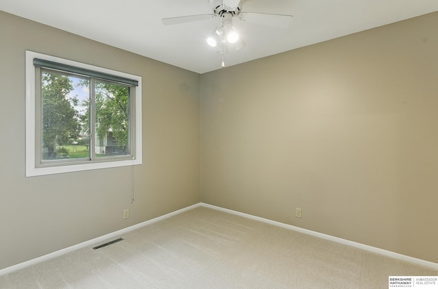 2615 Jack Pine St, Bellevue, NE 68123 - empty room with light carpet, a ceiling fan, and baseboards
