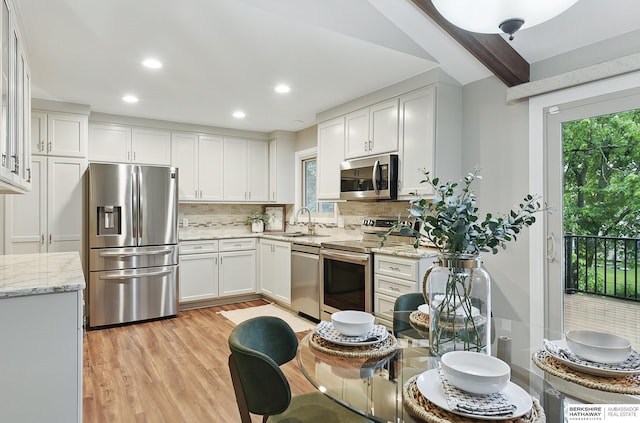 2615 Jack Pine St, Bellevue, NE 68123 - kitchen with appliances with stainless steel finishes, healthy amount of natural light, a sink, backsplash, and recessed lighting