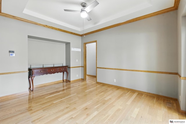 10428 Monroe St, Omaha, NE 68127 - spare room with a raised ceiling, ceiling fan, light wood finished floors, crown molding, and baseboards