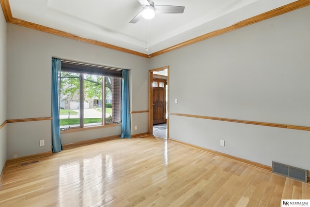 10428 Monroe St, Omaha, NE 68127 - spare room with ornamental molding, ceiling fan, wood finished floors, and baseboards