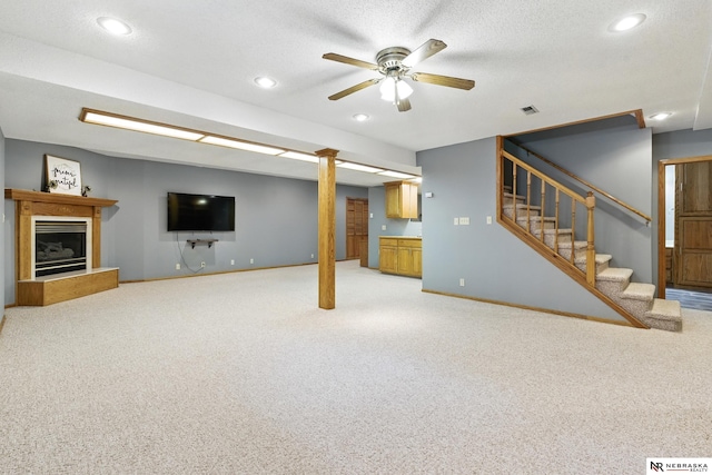 10428 Monroe St, Omaha, NE 68127 - unfurnished living room with light carpet, stairs, ceiling fan, baseboards, and recessed lighting
