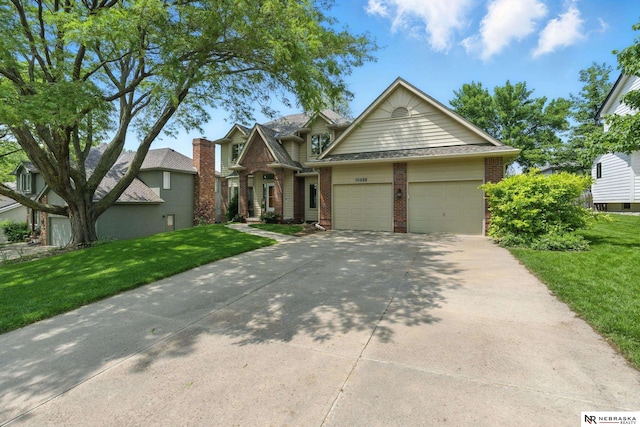 10428 Monroe St, Omaha, NE 68127 - view of front of home featuring brick siding, an attached garage, driveway, and a front lawn