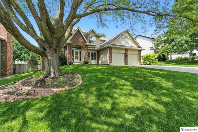 10428 Monroe St, Omaha, NE 68127 - view of front facade featuring brick siding, a garage, and driveway