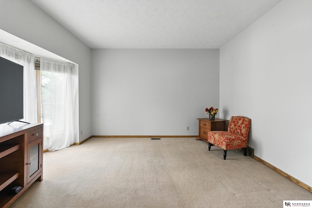 10428 Monroe St, Omaha, NE 68127 - sitting room with light carpet and baseboards