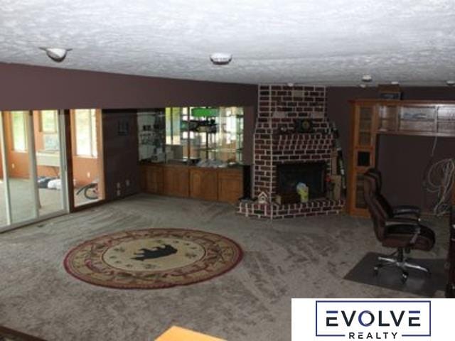 1599 S Main St Unit 7, Fremont, NE 68025 - carpeted living room featuring a textured ceiling and a fireplace