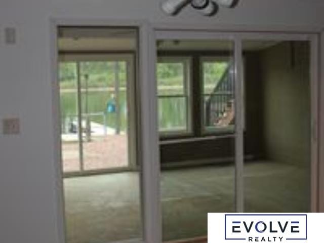1599 S Main St Unit 7, Fremont, NE 68025 - doorway to outside featuring healthy amount of natural light
