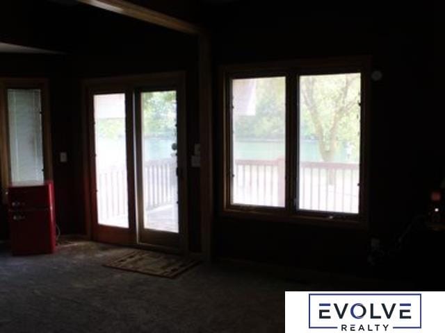 1599 S Main St Unit 7, Fremont, NE 68025 - doorway to outside with carpet floors