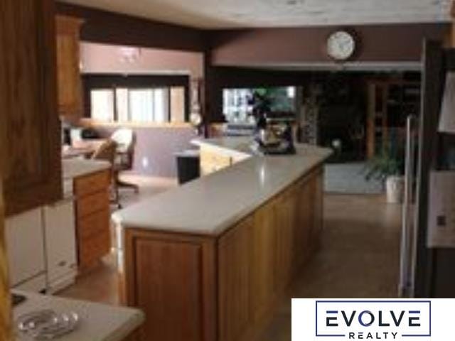 1599 S Main St Unit 7, Fremont, NE 68025 - kitchen with brown cabinetry and light countertops