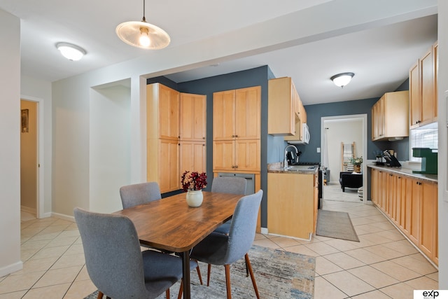 6772 Hamilton St, Omaha, NE 68132 - dining area featuring light tile patterned flooring and baseboards