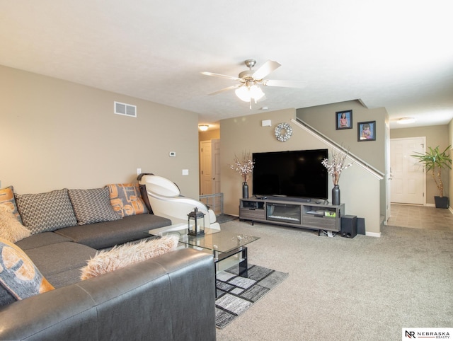 1715 Belford St, Lincoln, NE 68521 - carpeted living room with stairway, ceiling fan, and baseboards