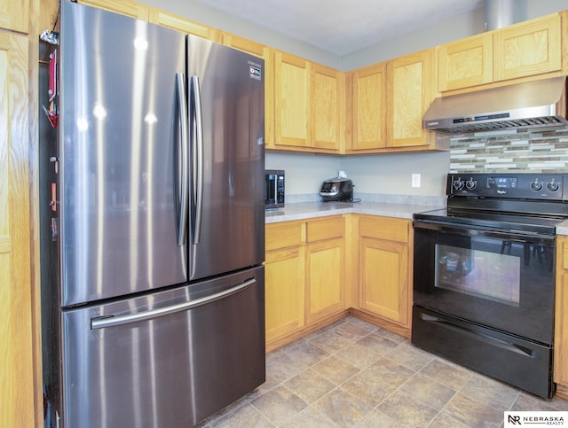 1715 Belford St, Lincoln, NE 68521 - kitchen with freestanding refrigerator, black / electric stove, extractor fan, light brown cabinets, and light countertops