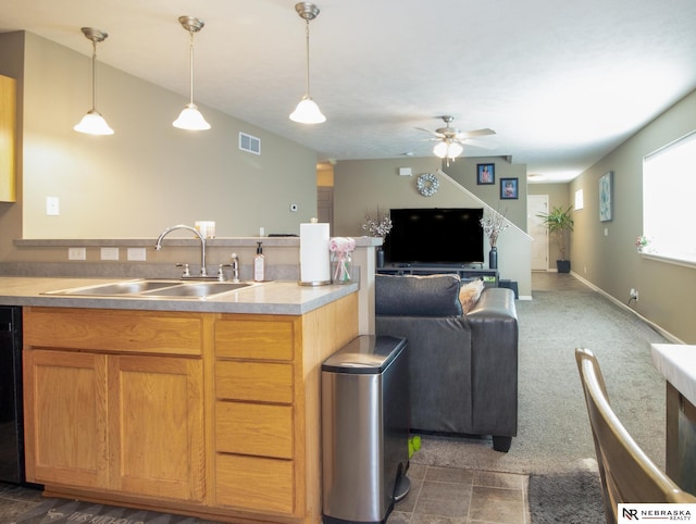 1715 Belford St, Lincoln, NE 68521 - kitchen with a sink, open floor plan, ceiling fan, decorative light fixtures, and a peninsula