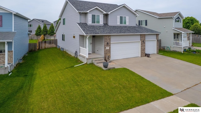 1715 Belford St, Lincoln, NE 68521 - view of front of property with a shingled roof, driveway, and an attached garage