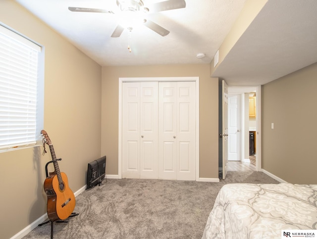 1715 Belford St, Lincoln, NE 68521 - carpeted bedroom with a closet, a ceiling fan, and baseboards