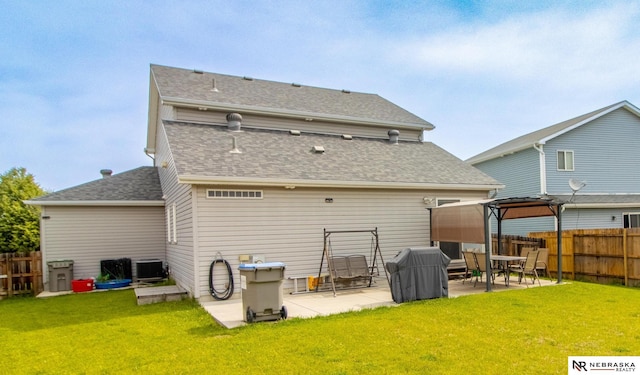 1715 Belford St, Lincoln, NE 68521 - back of property with a patio, roof with shingles, and cooling unit