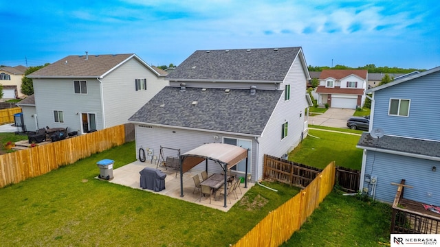 1715 Belford St, Lincoln, NE 68521 - back of house featuring roof with shingles, a patio area, a residential view, and a gazebo