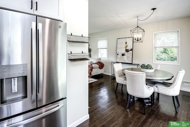 2833 S 107th St, Omaha, NE 68124 - dining space with plenty of natural light, a chandelier, and dark wood-type flooring