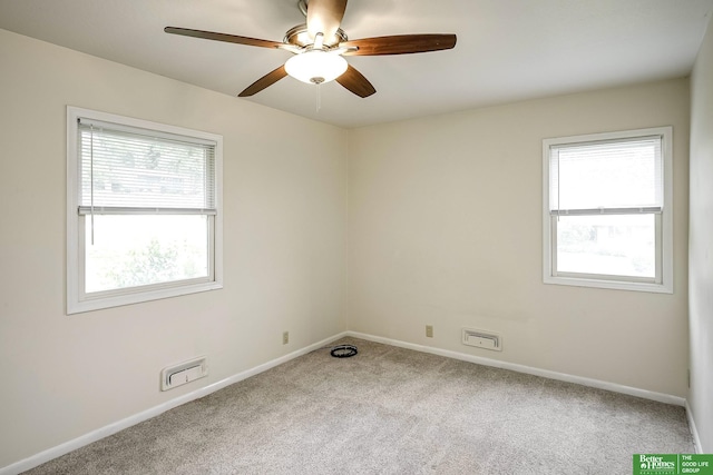 2833 S 107th St, Omaha, NE 68124 - empty room featuring carpet flooring, ceiling fan, and baseboards