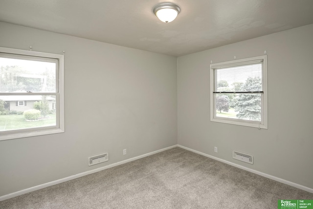 2833 S 107th St, Omaha, NE 68124 - carpeted spare room featuring baseboards