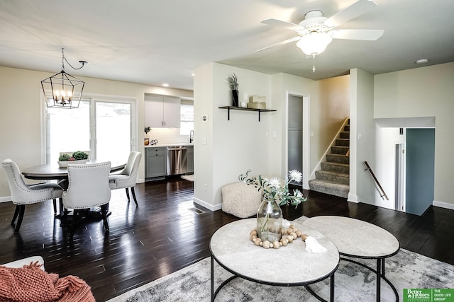 2833 S 107th St, Omaha, NE 68124 - living room with dark wood-type flooring, stairway, ceiling fan, and baseboards