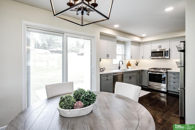 2833 S 107th St, Omaha, NE 68124 - dining space with dark wood-style floors and recessed lighting