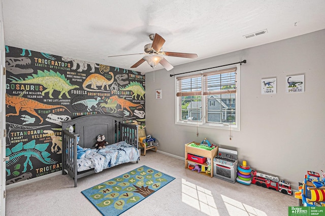 2231 Crystal Creek Dr, Papillion, NE 68046 - carpeted bedroom with ceiling fan, a textured ceiling, and baseboards