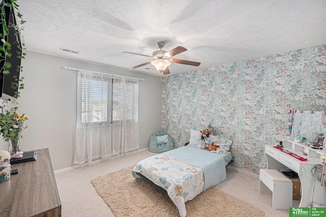 2231 Crystal Creek Dr, Papillion, NE 68046 - bedroom featuring baseboards, light carpet, a textured ceiling, and ceiling fan