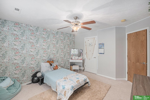 2231 Crystal Creek Dr, Papillion, NE 68046 - bedroom featuring carpet flooring, baseboards, ceiling fan, and wallpapered walls