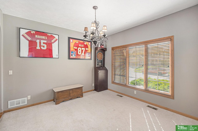 2231 Crystal Creek Dr, Papillion, NE 68046 - spare room with a chandelier, baseboards, and carpet
