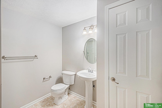 2231 Crystal Creek Dr, Papillion, NE 68046 - half bath with toilet, a textured ceiling, tile patterned floors, and baseboards