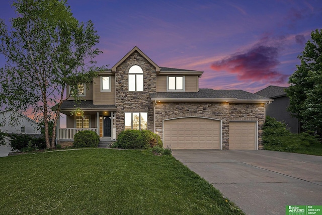 2231 Crystal Creek Dr, Papillion, NE 68046 - traditional-style home featuring stone siding, driveway, a front yard, a garage, and covered porch