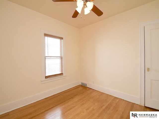4540 S 41st St, Omaha, NE 68107 - unfurnished room featuring light wood-style flooring, ceiling fan, and baseboards