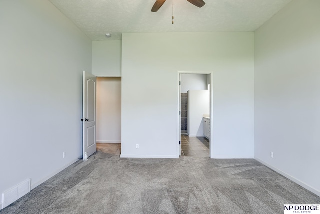 15930 Grebe St, Bennington, NE 68007 - unfurnished bedroom with carpet floors, baseboards, a ceiling fan, and ensuite bath
