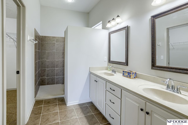 15930 Grebe St, Bennington, NE 68007 - full bath featuring double vanity, a walk in shower, a spacious closet, and baseboards