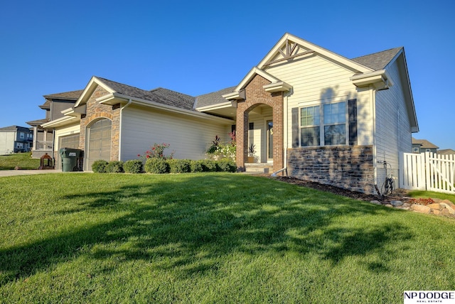 15930 Grebe St, Bennington, NE 68007 - view of front of property featuring stone siding, an attached garage, roof with shingles, and concrete driveway