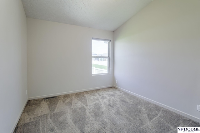 15930 Grebe St, Bennington, NE 68007 - spare room with carpet, lofted ceiling, and baseboards