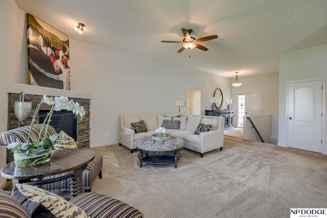 15930 Grebe St, Bennington, NE 68007 - carpeted living area featuring a ceiling fan, a stone fireplace, and baseboards